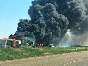 Two trains collided Sunday near the Oklahoma Panhandle town of Goodwell, sparking a diesel fire and forcing the closure of a stretch of highway. Three people were missing.