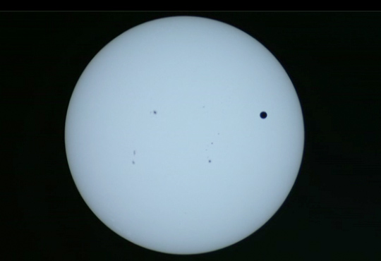 live image from nasa monitoring venus transit cross the Sun June 5th 6th 2012 Tuesday Wednesday