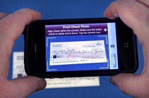 deposit check by taking picture from your mobile phone android tablet iphone simply sign it and take picture of it and voila money in the bank