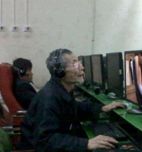 elderly playing computer internet online gaming Go Cong Tien Giang Tan Thoi Tan Phu Dong
