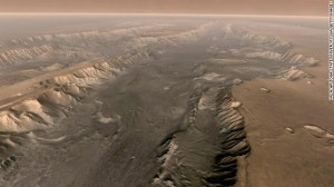 The Valles Marineris rift system on Mars is 10 times longer, five times deeper and 20 times wider than the Grand Canyon. This composite image was made aboard NASA's Mars Odyssey spacecraft, which launched in 2001.