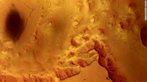 The European Space Agency's Mars Express captured this view of Valles Marineris in 2004. The area shows mesas and cliffs as well as features that indicate erosion from flowing water.
